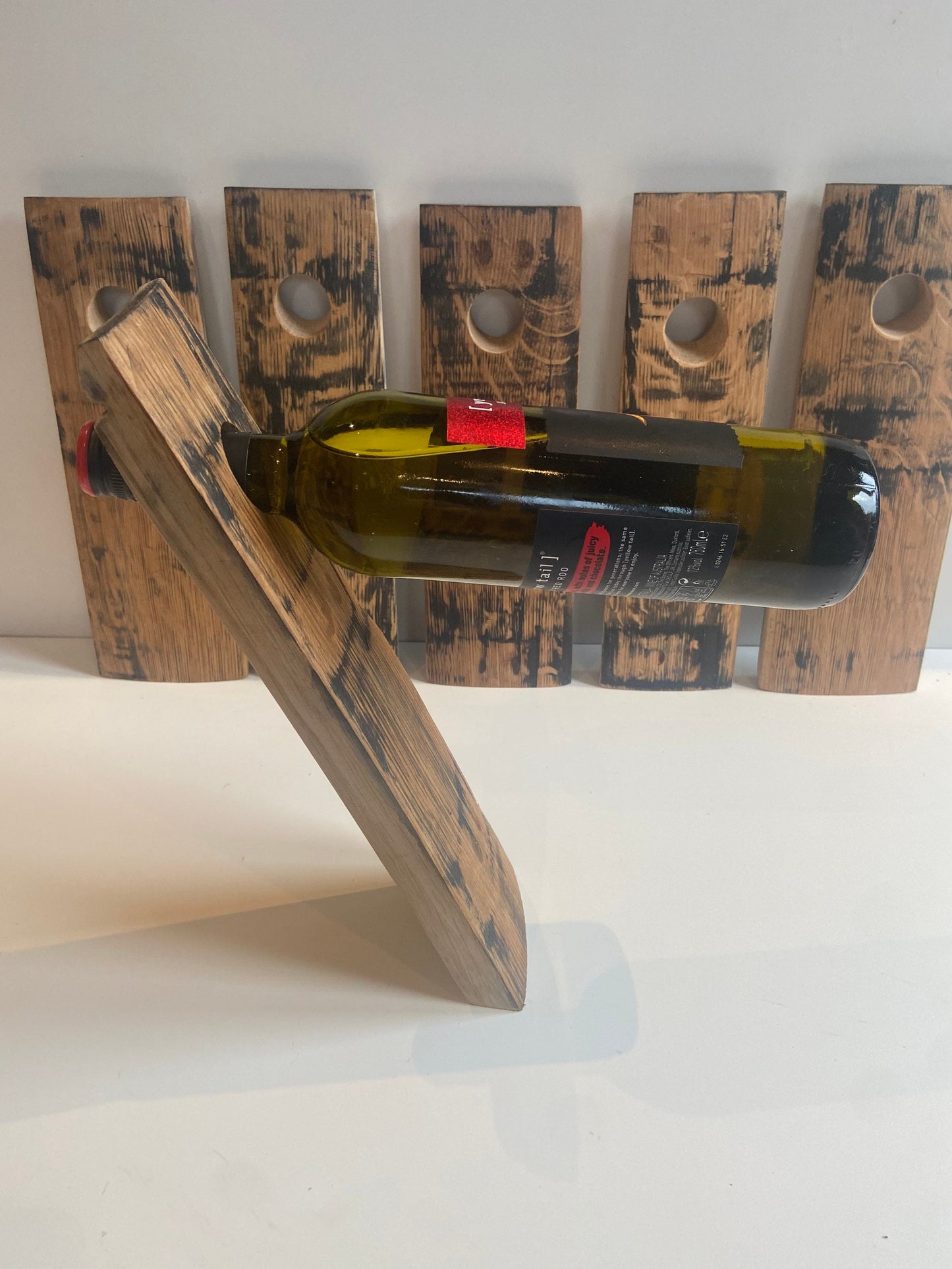 Gravity wine bottle holder