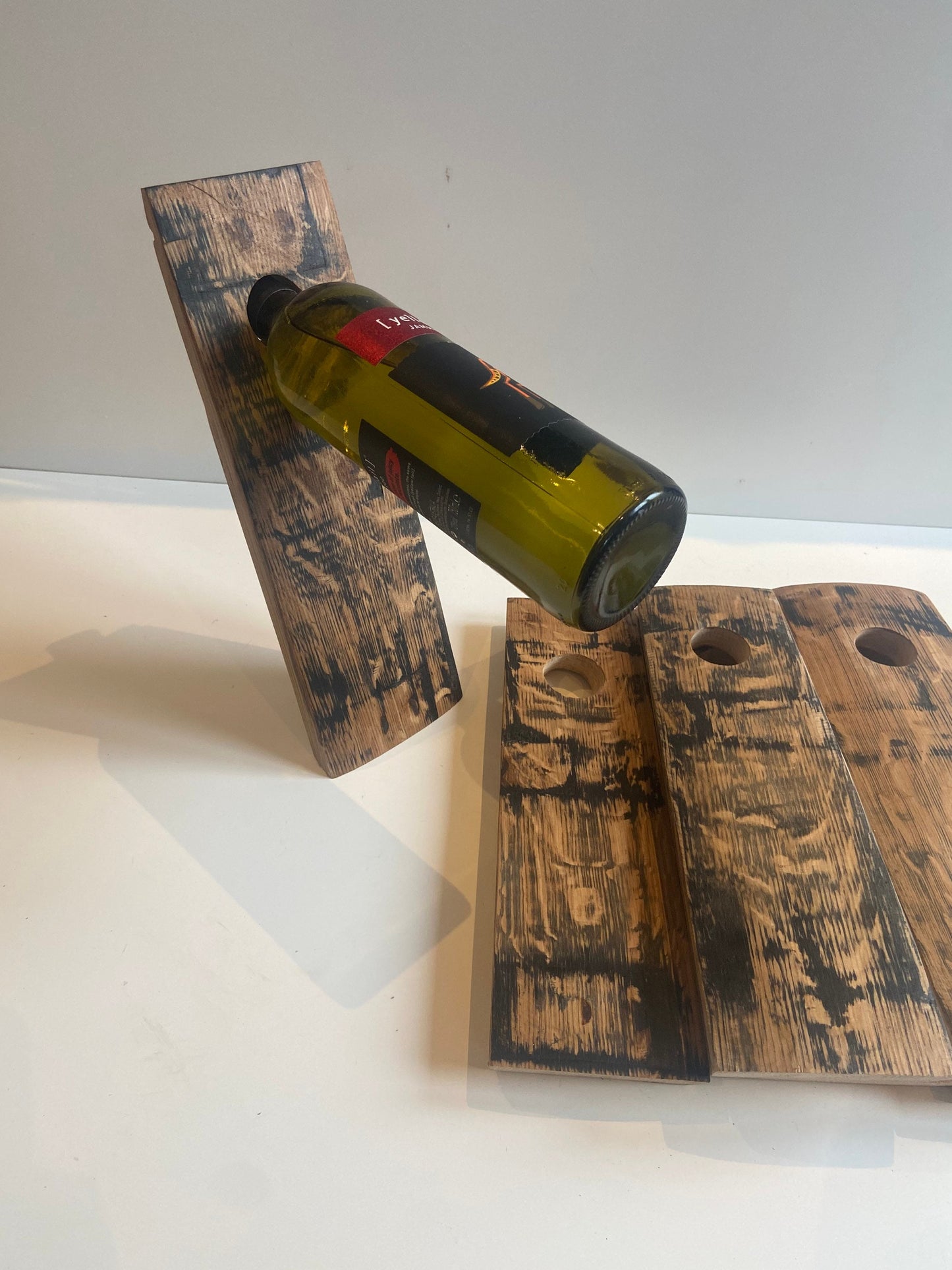 Gravity wine bottle holder