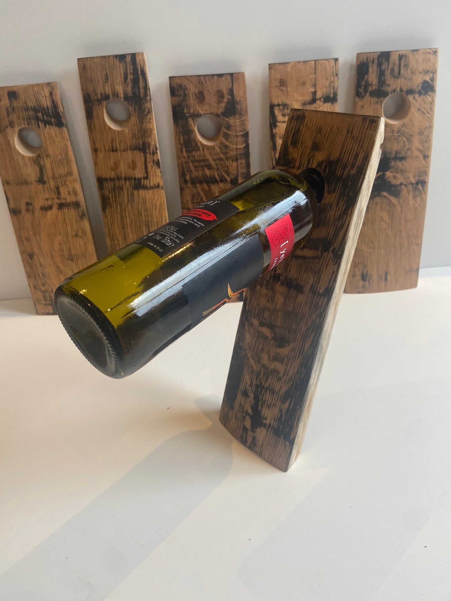 Gravity wine bottle holder