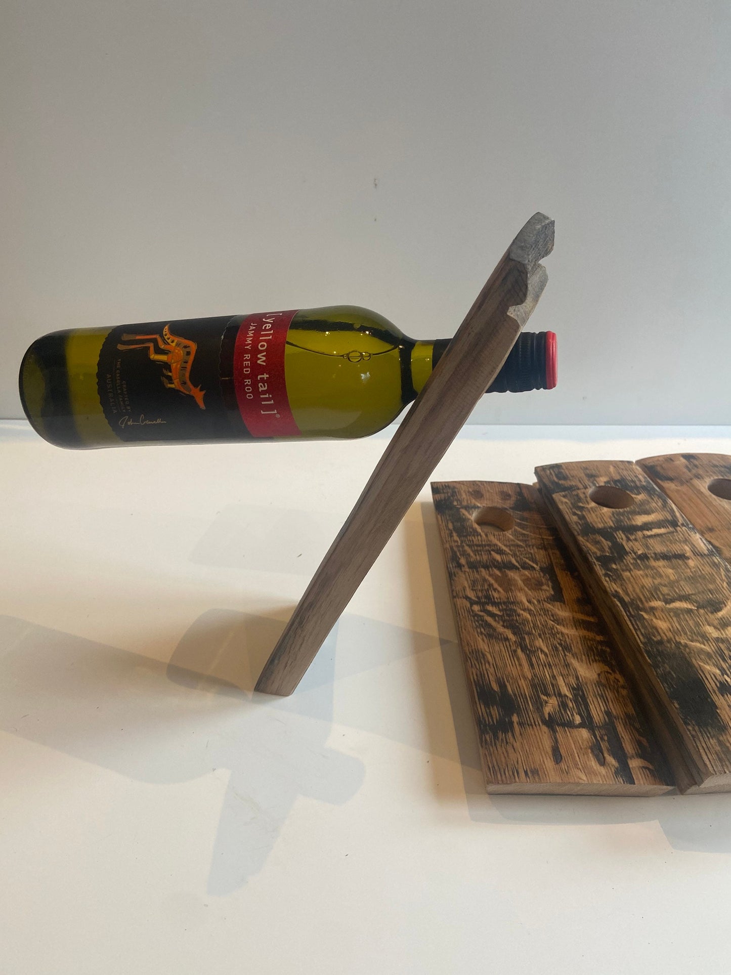 Gravity wine bottle holder