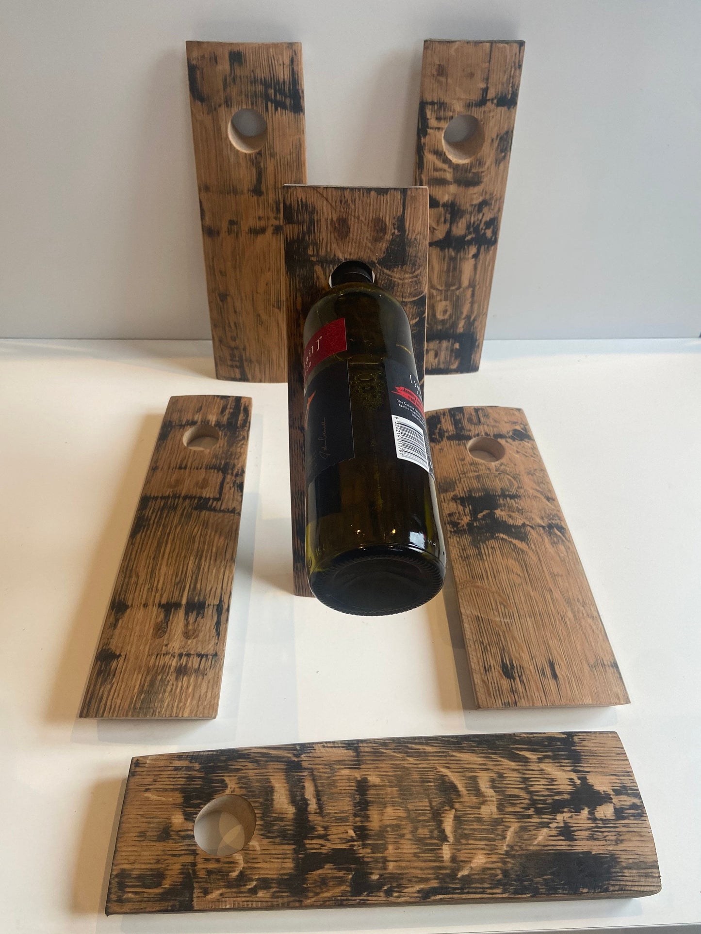 Gravity wine bottle holder