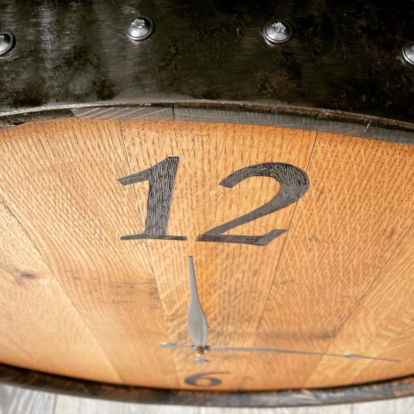 clock handmade from a whisky barrel end